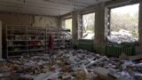 Books on the floor among debris in school library in Kramatorsk in Ukraine