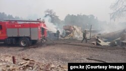 Firefighters battle fires in the northern Qostanai region on September 4.