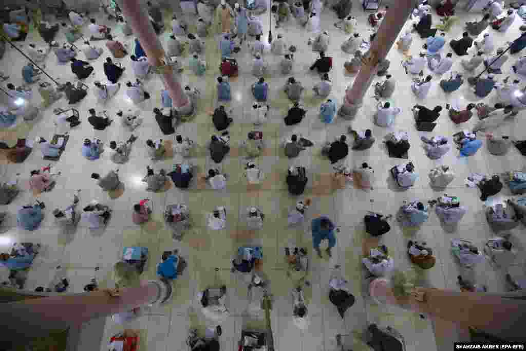 Pakistani religious students take seminary midterm exams in the southern port city of Karachi.