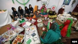 Afghan students display their creations during an exhibition of handicrafts, in Herat, October 2015.