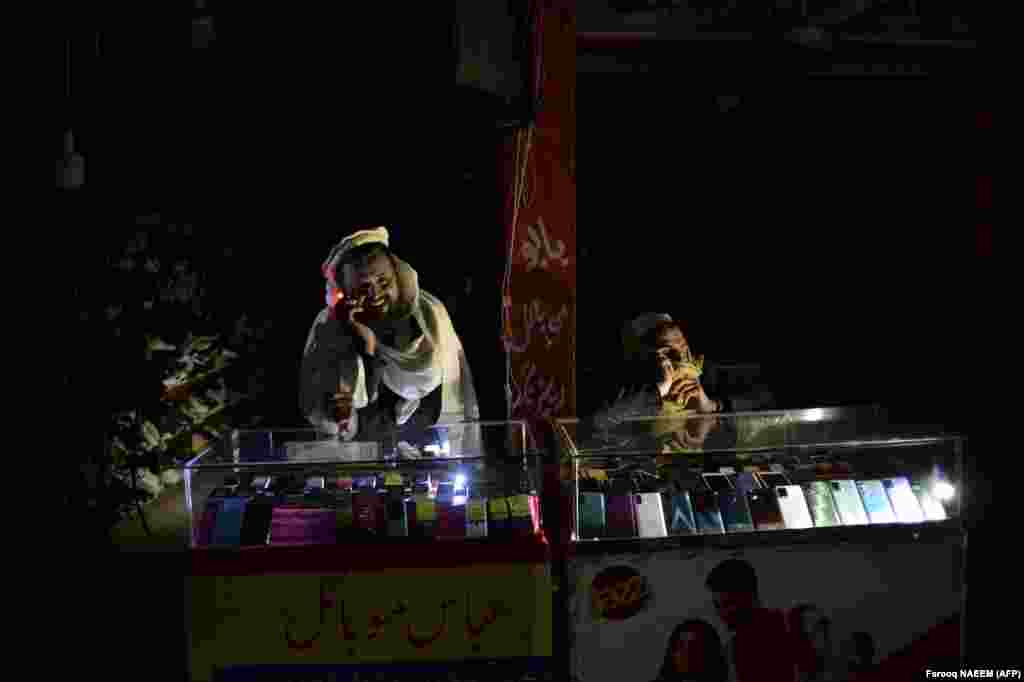 Shopkeepers sit at a market in Islamabad during a nationwide power outage.&nbsp; Energy Minister Khurram Dastgir said that engineers were working to restore power as he tried to reassure the nation. &quot;As an economic measure, we temporarily shut down our power generation systems,&quot; Dastgir said. When engineers tried to turn the systems back on, a fluctuation in voltage was observed, which forced engineers to shut down the power-grid stations one by one. &nbsp;