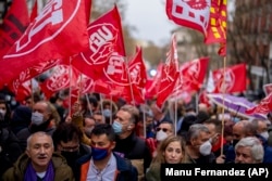 People protest high energy prices in Madrid in March 2022.