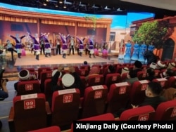 Members of the World Muslim Communities Council attend a Uyghur performance in Urumqi, the capital of Xinjiang, on January 8.