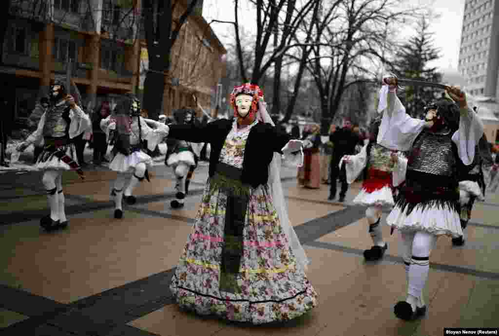 The festival involves participants wearing multicolored masks covered with beads, ribbons, and woolen tassels.