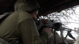 Ukrainian soldiers with guns in Donbas region 