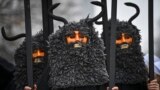 Masked dancers, known as Kukeri, perform during the International Festival of Masquerade Games in Pernik, Bulgaria, on January 28.