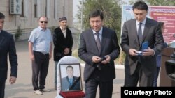 People attend the funeral of wildlife ranger Qanysh Nurtazinov, who was killed in July 2019. 