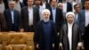 Iranian President Hassan Rouhani (left foreground) with Ayatollah Sadeq Larijani, the chief of Iran's Judiciary and now the new head of the Expediency Council