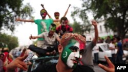 Pakistani supporters of cricketer-turned-politician Imran Khan.
