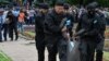 Сотрудники полицейского спецназа задерживают участников антиправительственного митинга в день президентских выборов. Алматы, 9 июня 2019 года.