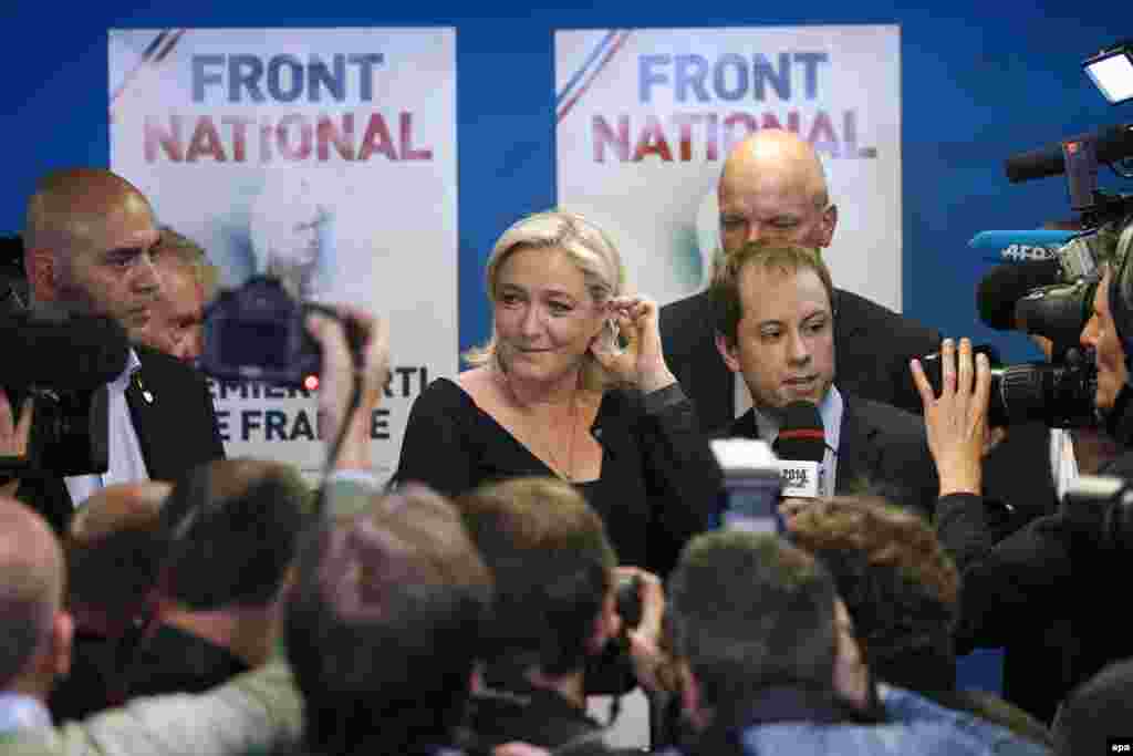 Marine Le Pen (center), the president of France's far-right National Front party, speaks after her party won 26 percent of the country's vote for members of the European Parliament, ahead of the governing Socialists and the center-right Union for a Popular Movement.