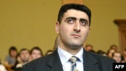 Azerbaijani Lieutenant Ramil Safarov listens to the verdict in April 2006 for hacking to death an Armenian lieutenant while attending a NATO-sponsored training course in Budapest.