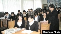 Uzbekistan - Uzbek teacher and her class, undated