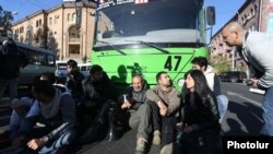 Opposition leader Nikol Pashinian (center) and his supporters block traffic on a street in Yerevan on April 16.