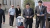 People attend the funeral of wildlife ranger Qanysh Nurtazinov, who was killed in July 2019. 