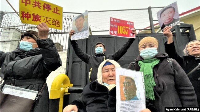 People demonstrate outside the Chinese Consulate in Almaty, demanding the release of relatives in China's Xinjiang region, in February 2021.