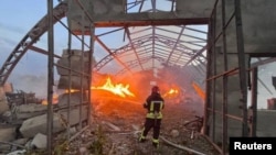 A firefighter works at a site that was hit amid Russian drone attacks in Ukraine's Odesa region on September 4.