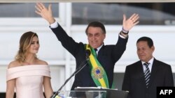 Brazil's new president, Jair Bolsonaro, waves to supporters during his inauguration on January 1.