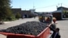 Armenia -- Farmers deliver grapes to a storage facility in the Ararat Valley.