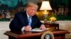 U.S. -- U.S. President Donald Trump signs a proclamation declaring his intention to withdraw from the JCPOA Iran nuclear agreement in the Diplomatic Room at the White House in Washington, U.S., May 8, 2018. 