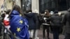 Protesters donned Georgian and EU flags outside the Georgian Foreign Ministry building in Tbilisi on December 2.