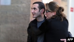 Former Georgian Defense Minister David Kezerashvili (left) embraces his wife, Sophia, as he leaves a prison in Marseille on February 3.