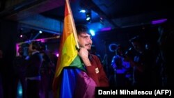 A member of the LGBT community waits for the results of the referendum in Bucharest on October 7.