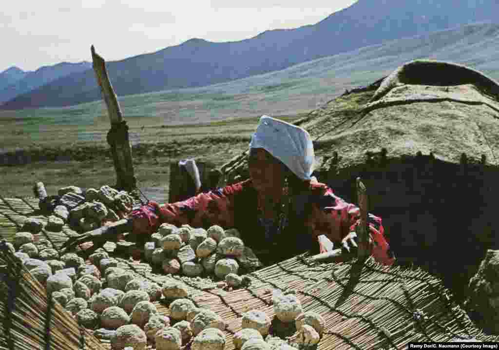 A woman dries &quot;qurut&quot; -- cheese curd -- in the sun.