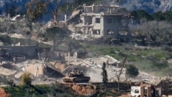 An Israeli tank maneuvers in Lebanon as seen from the Israeli side of the border on March 5.