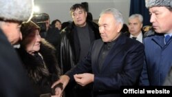 President Nursultan Nazarbaev (second from right) meeting with officials in the region a week after the deaths in Zhanaozen in December 2011.