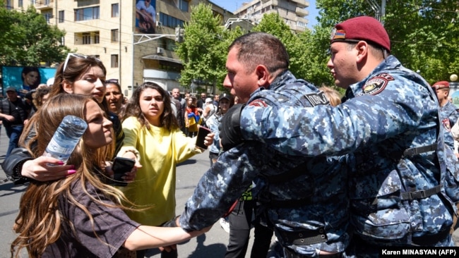 ARMENIA - Police officers detain opposition supporters who attempted to block streets in the capital Yerevan on May 17, 2022.