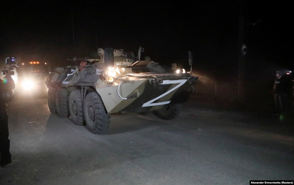 A convoy of Kremlin-backed separatists escorts buses transporting Ukrainian soldiers from the besieged Azovstal steel plant in Mariupol late on May 16. Deputy Defense Minister Hanna Malyar said 53 badly wounded soldiers were taken to a hospital in separatist-held Novoazovsk, while another 211 were evacuated through a humanitarian corridor to another site.