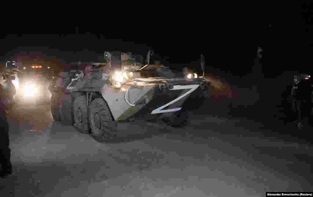 A convoy of Kremlin-backed separatists escorts buses transporting Ukrainian soldiers from the besieged Azovstal steel plant in Mariupol late on May 16. Deputy Defense Minister Hanna Malyar said 53 badly wounded soldiers were taken to a hospital in separatist-held Novoazovsk, while another 211 were evacuated through a humanitarian corridor to another site.