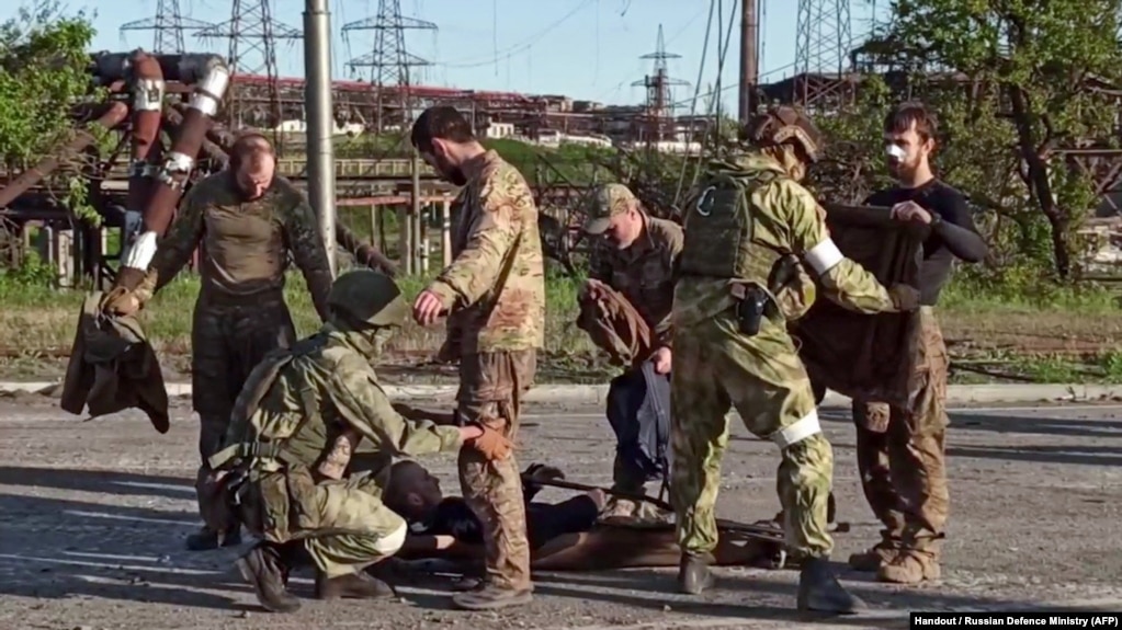 A video released by the Russian Defense Ministry shows Ukrainian soldiers being checked by separatist troops after being evacuated from the besieged Azovstal steel plant.