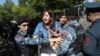 Armenia - Riot police detain an opposition protester in Yerevan, May 17, 2022.