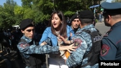 Armenia - Riot police detain an opposition protester in Yerevan, May 17, 2022.