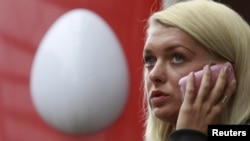 A woman speaks on the phone near an office of Russia's mobile phone operator MTS in Moscow. (file photo)