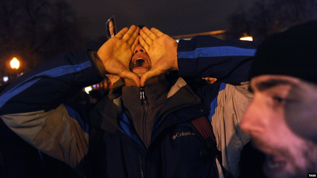 An opposition activist shouts slogans during the rally in central Moscow 