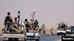 U.S.-backed Syrian Democratic Forces (SDF) fighters on their way to Raqqa, June 6, 2017