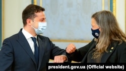 Ukrainian President Volodymyr Zelenskiy (left) greets U.S. Undersecretary of State for Political Affairs Victoria Nuland in Kyiv on May 6.