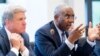 U.S. Representative Gregory Meeks (right) speaks as Representative Michael McCaul (left) listens in Prague on May 25.
