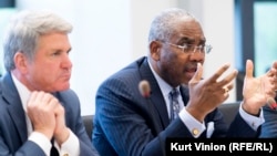 U.S. Representative Gregory Meeks (right) speaks as Representative Michael McCaul (left) listens in Prague on May 25.