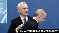 NATO Secretary-General Jens Stoltenberg (left) and Turkish President Recep Tayyip Erdogan (file photo)