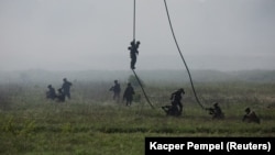 Polish soldiers participate in a NATO military exercise near Orzysz, Poland, in May 2022.