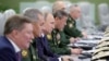 Russian President Vladimir Putin (third left) visits the National Defense Control Center to oversee the test of Russia's Avangard hypersonic missile system, which can carry nuclear warheads, in Moscow in 2018. 