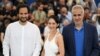 Iranian-Danish director Ali Abbasi, Iranian actress Zar Amir Ebrahimi, and Iranian actor Mehdi Bajestani pose during a photo call for the film Holy Spider at Cannes Film Festival on May 23, 2022. Ebrahimi took home the Best Actress award for her role.
