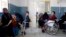 Afghan women and children wait to receive medical service at the pediatric center of the International Committee of the Red Cross (ICRC) in Kabul.