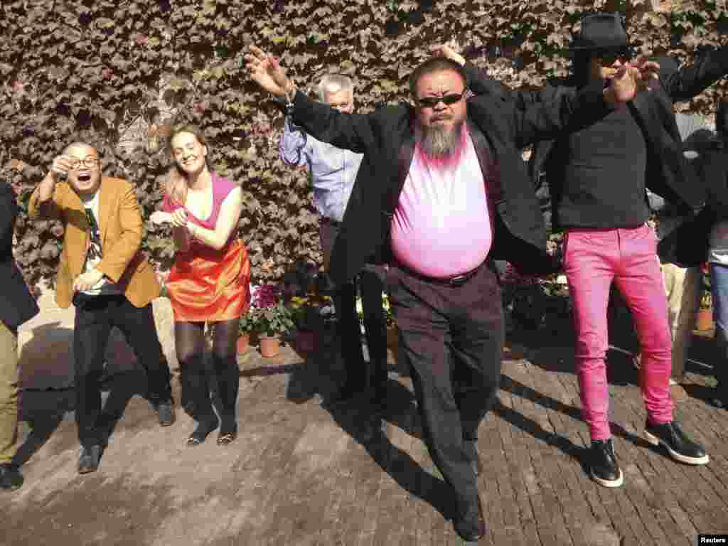 Dissident Chinese artist Ai Weiwei (front) dances with his friends as they make a cover version of the music video of "Gangnam Style" by South Korean singer Psy in the courtyard of Ai's studio in Beijing. (Reuters/Courtesy of Ai Weiwei)