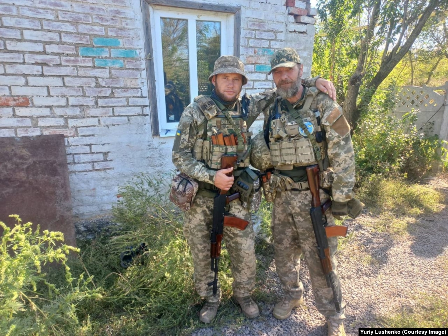 Lushenko (right) during his service in 2023 leading an infantry assault group