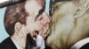 Germany – The painting displaying kissingg communist leaders Leonid Brezhnev and Erich Honecker is one of the painting to be restored by the artists themselves. Berlin, May 21,2014
